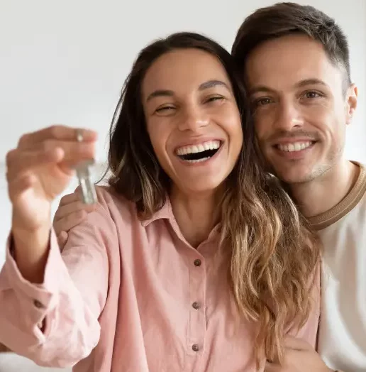 Happy Couple holding new home keys