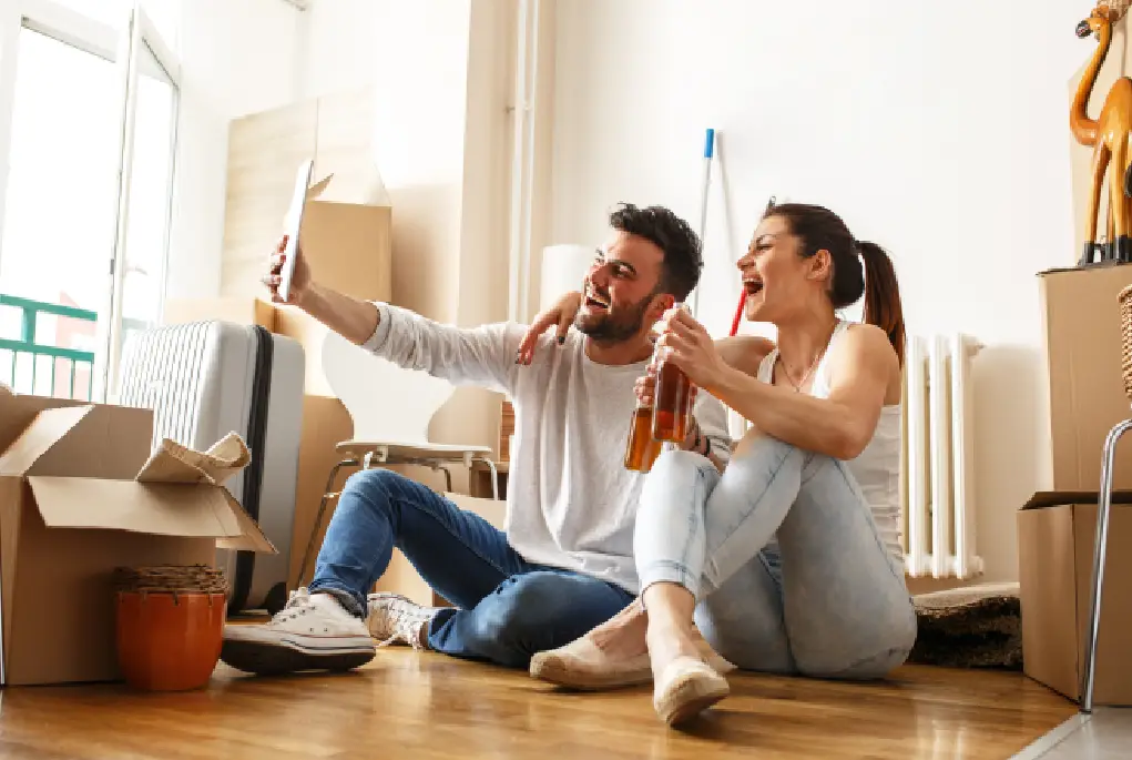 A happy couple take a photo celebrating their Home Loan Pre-Approval.