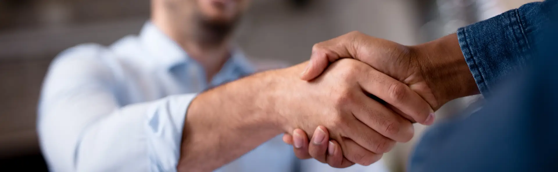 Client shaking mortgage brokers hand