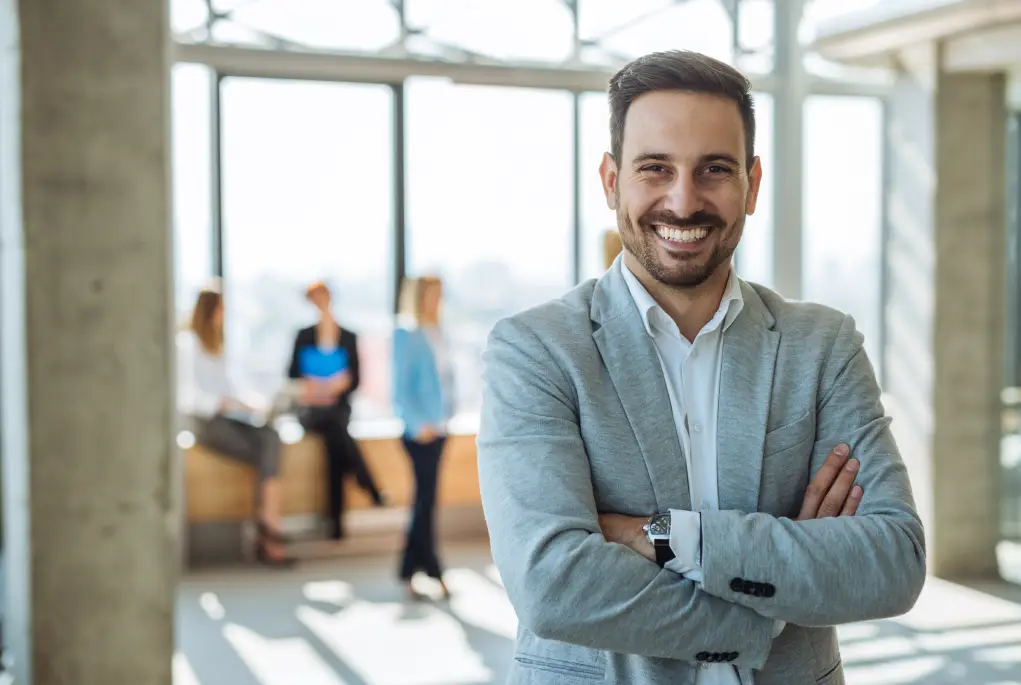 A commercial property client smiling in an office setting.