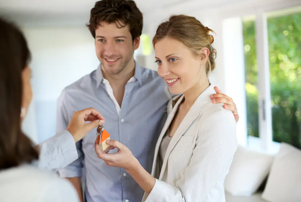 A young couple are handed the keys to their First Home.