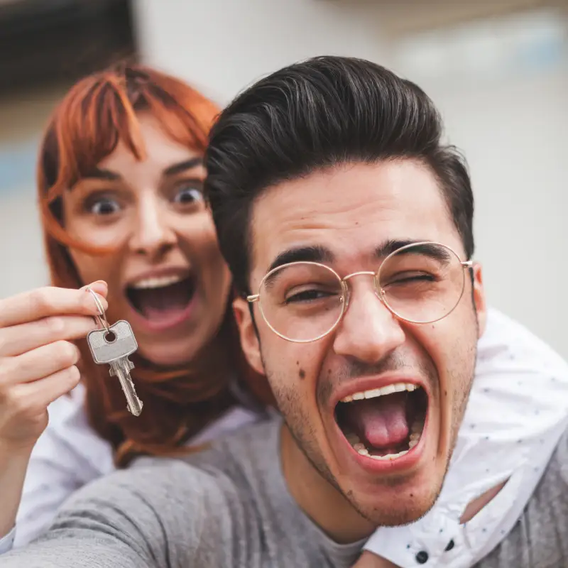 Happy Couple Cheering about Investment Loan