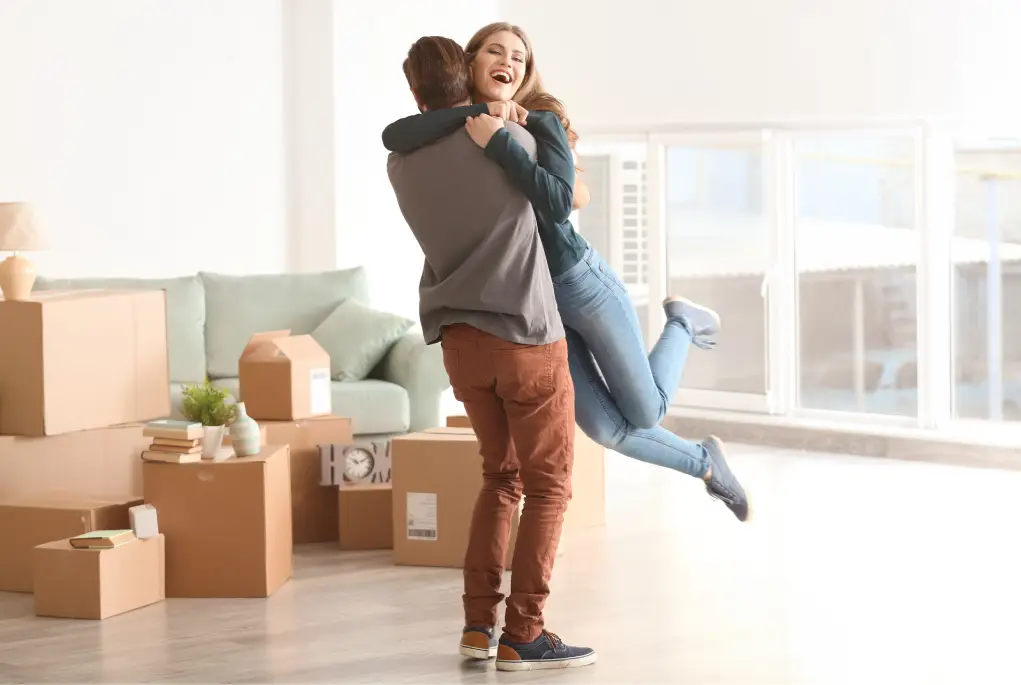 A husband and Wife celebrate with joy for their Home Loan Pre-Approval.