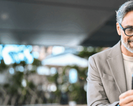 Man on his phone applying for a self managed super fund (SMSF) home loan