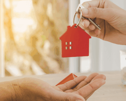 Self-employed business owner receiving house keys after their home loan settled