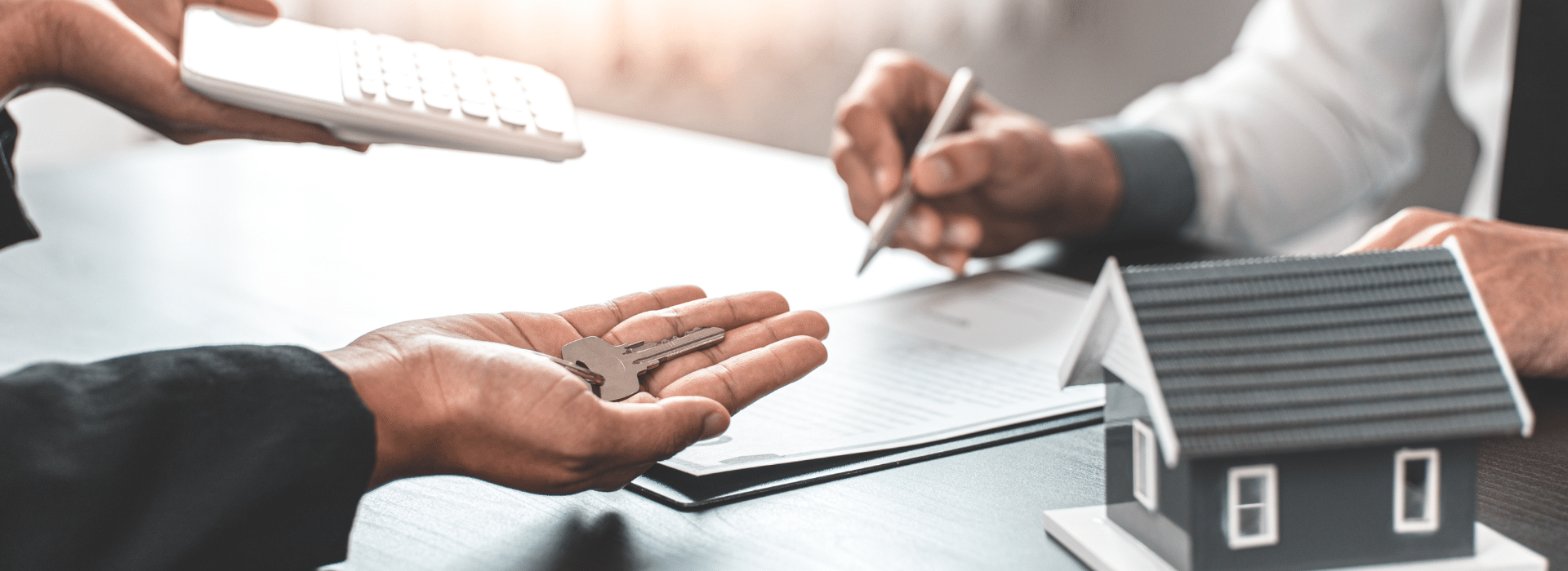 Buyer holding keys after getting a home loan pre-approval and settling their home loan