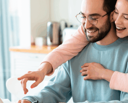 Couple reviewing their home loan to help use equity in their home to refinance