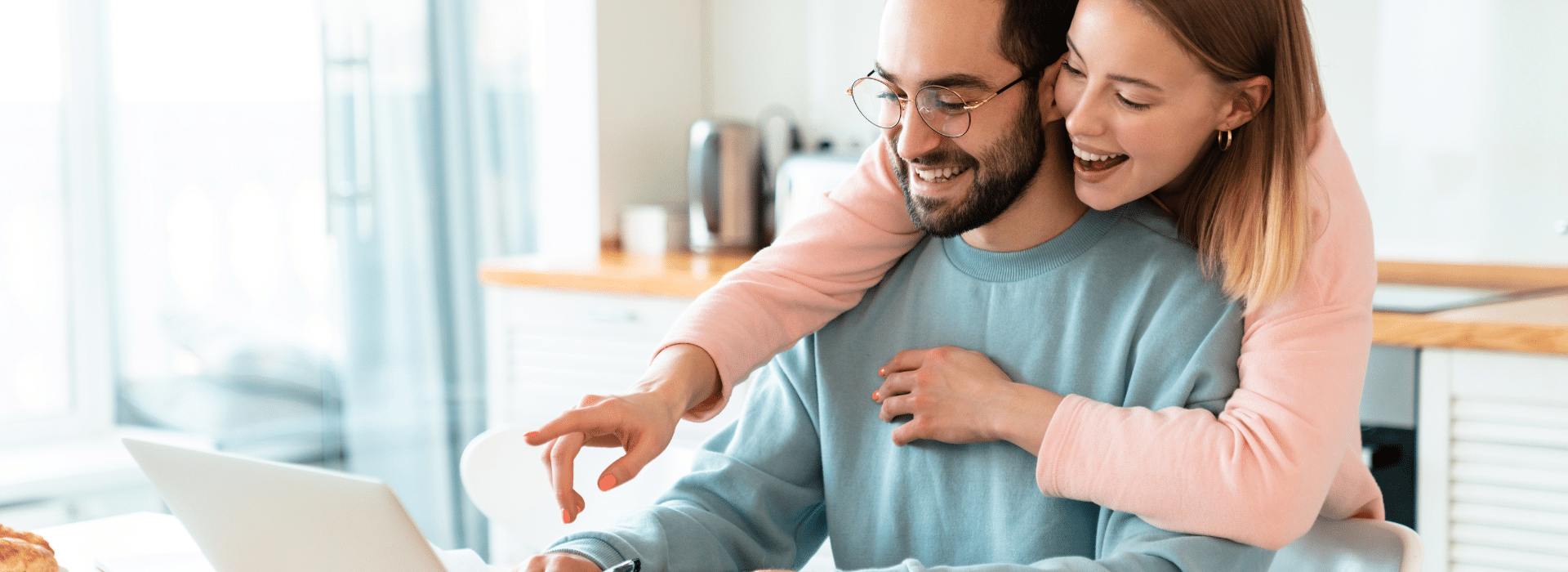 Couple reviewing their home loan to help use equity in their home to refinance
