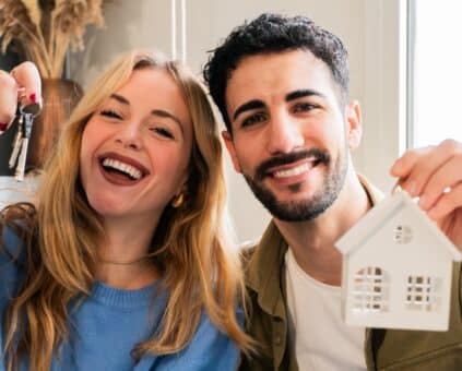 Couple celebrating purchasing a first home